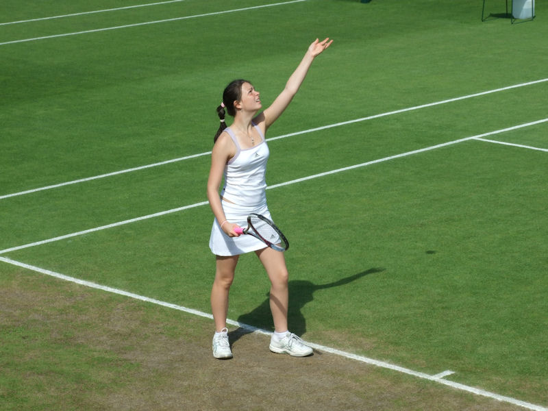 Amy Ellis serving on the hallowed Wimbledon grass at the Road To Wimbledon tournament 2008.