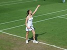 Amy Ellis serving on the hallowed Wimbledon grass at the Road To Wimbledon tournament 2008.